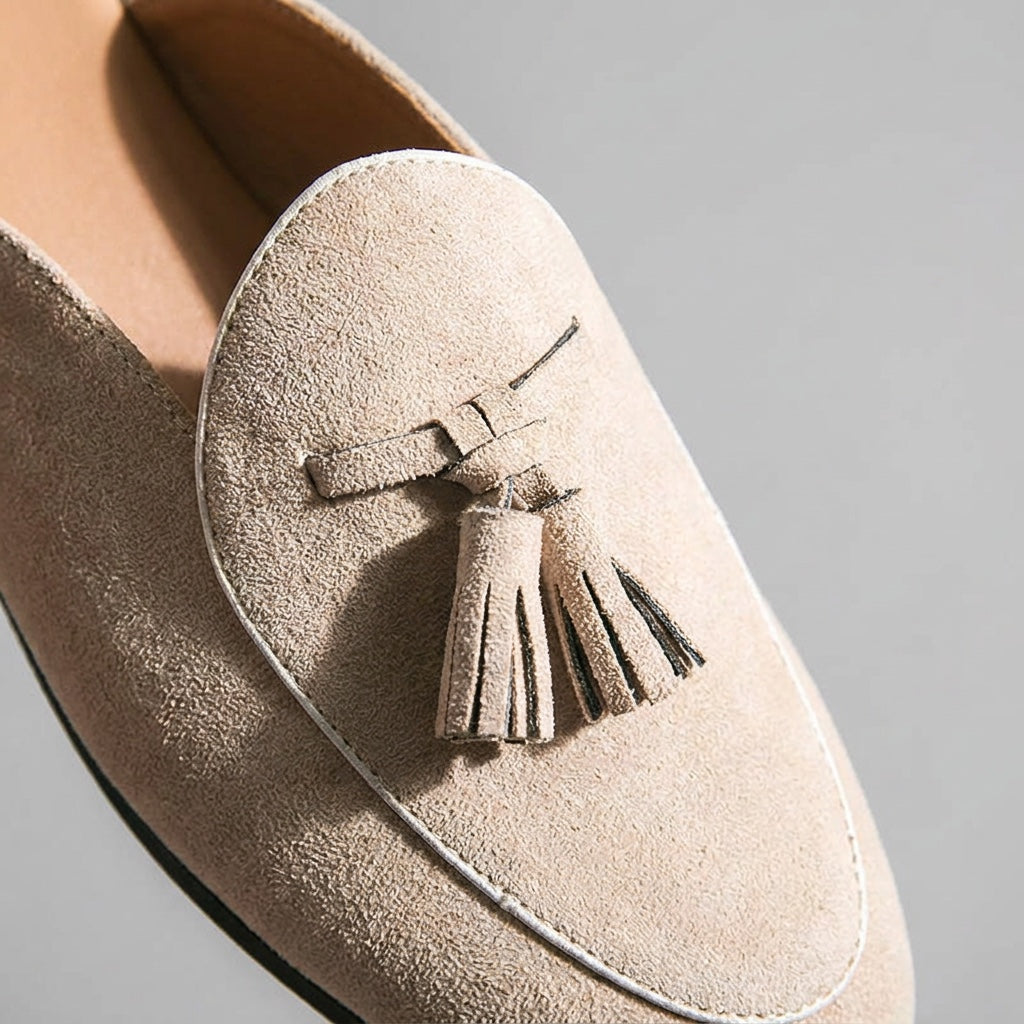Vasto Suede Mules — Beige, close-up tassel and vamp suede texture