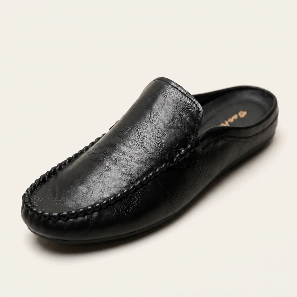 Vietri Leather Mules — Black, three-quarter studio view
