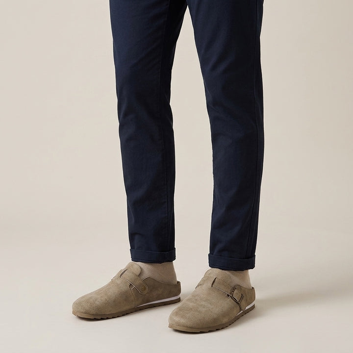 Volterra Suede Mules — Sand, worn on model, studio
