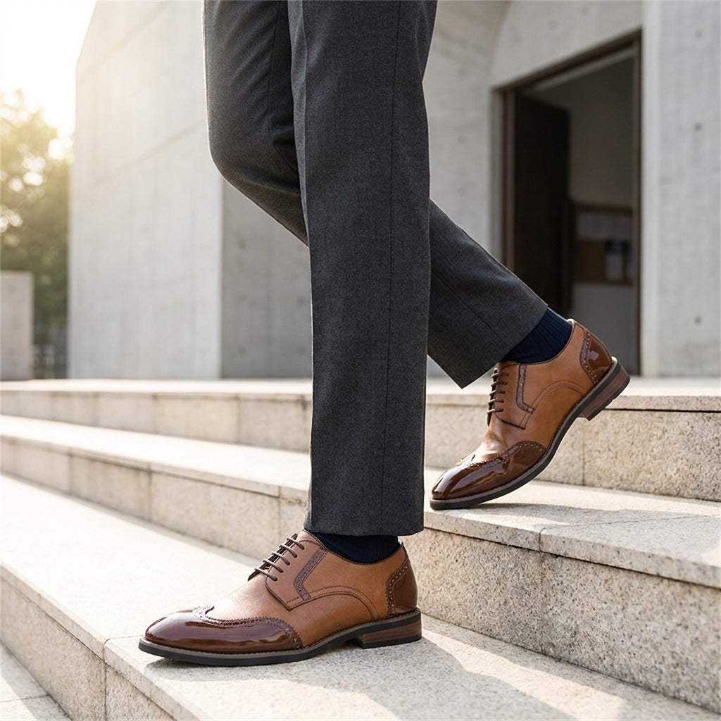 Tortona Leather Wingtip Brogues — Cognac, worn on stone steps