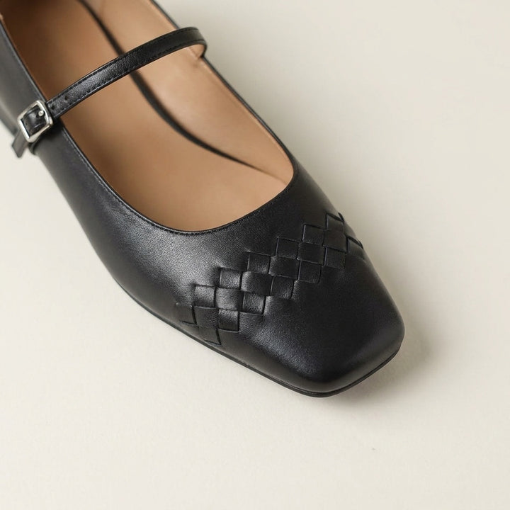 Ravenna Mary Janes — Black, close view of the woven toe and buckle