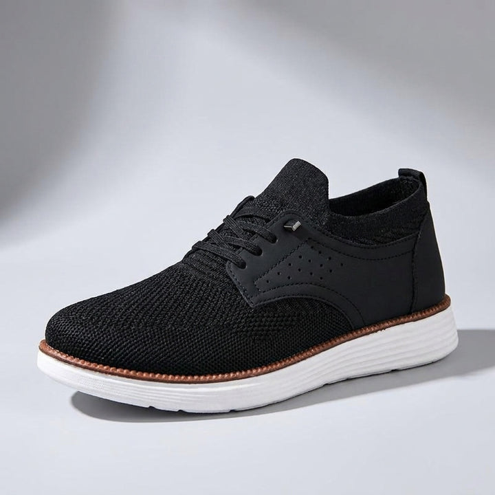 Savona Mesh Sneakers — Black, three-quarter studio view, light-grey gradient backdrop