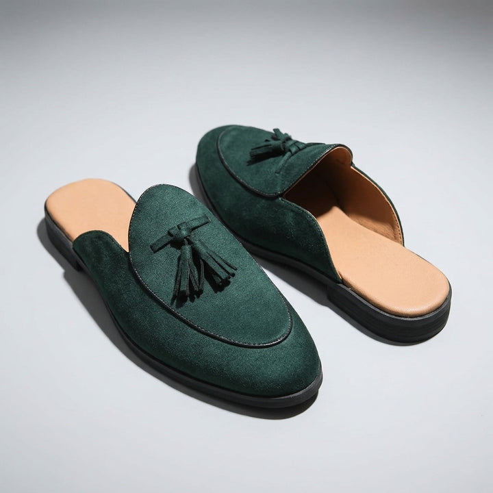 Vasto Suede Mules — Dark Green, three-quarter front view, both shoes paired, open-back visible