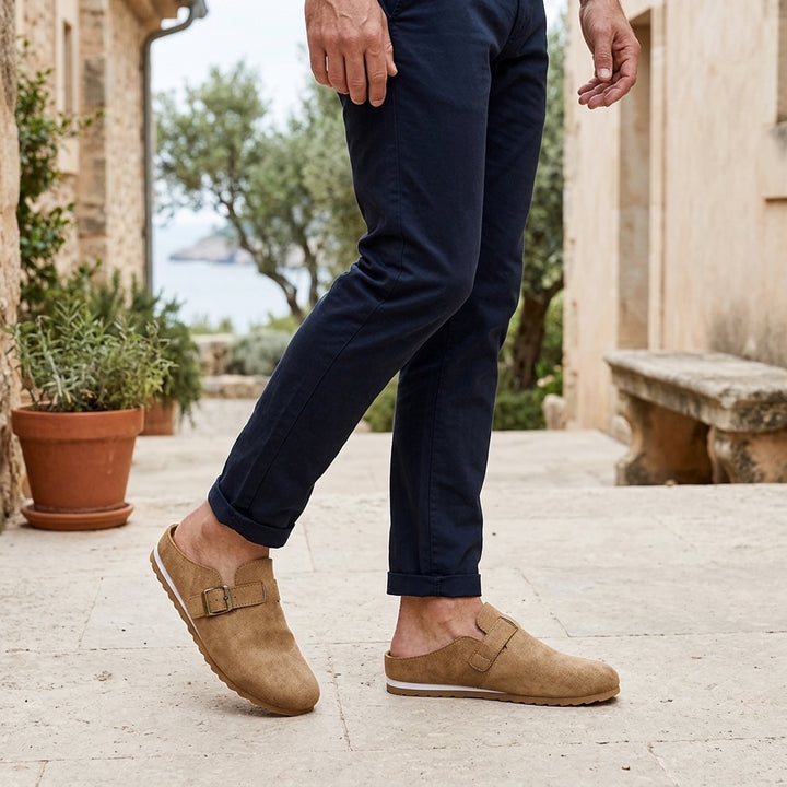 Volterra Suede Mules — Camel, worn on model, garden terrace