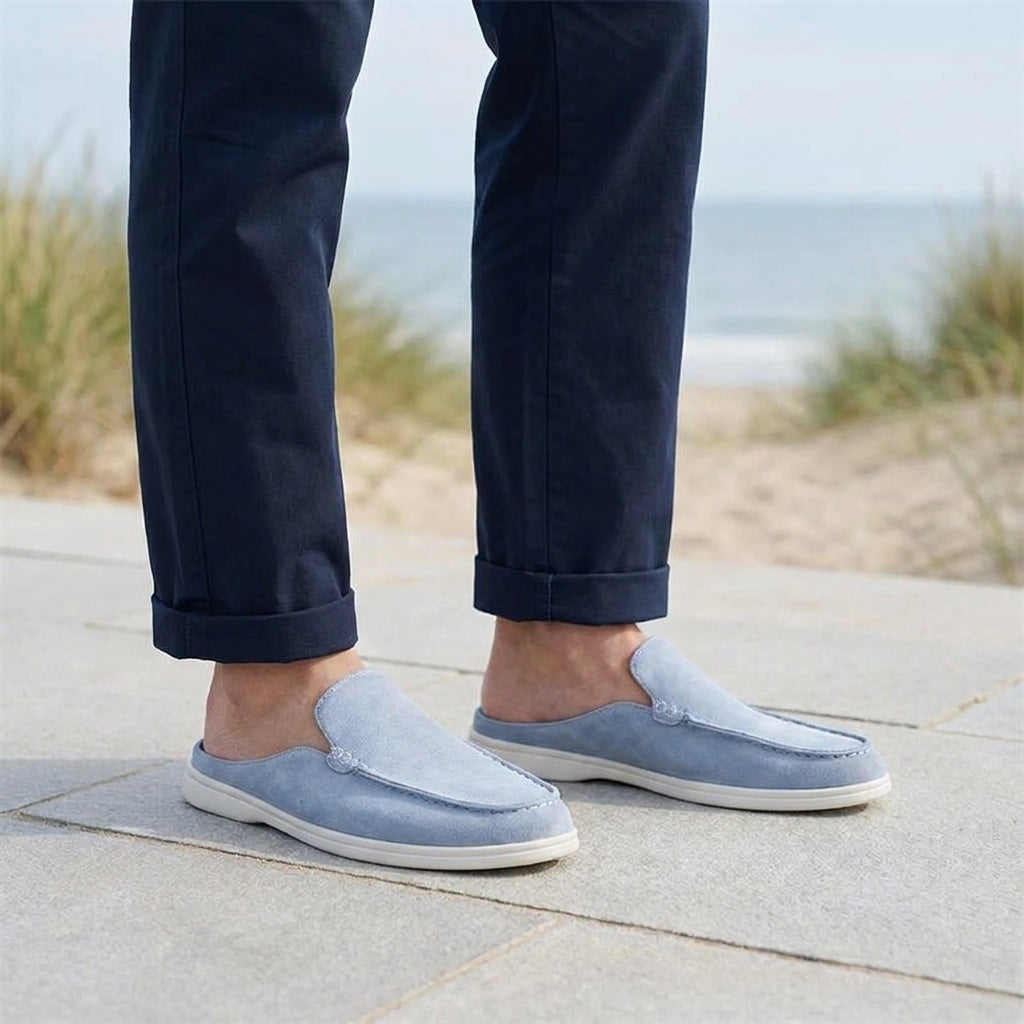 Dartmouth Suede Loafers — Blue, male model knee-down coastal pavement