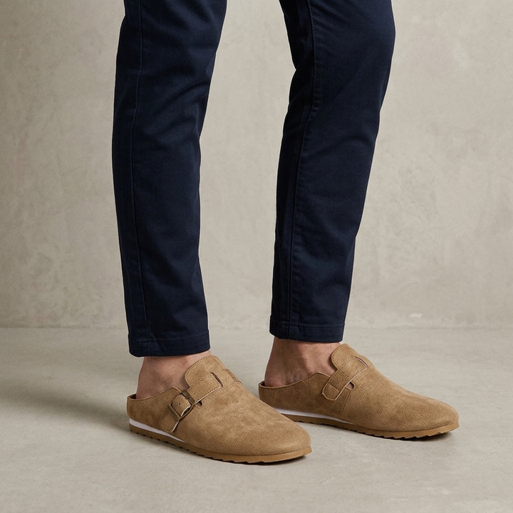 Volterra Suede Mules — Camel, worn on model, studio