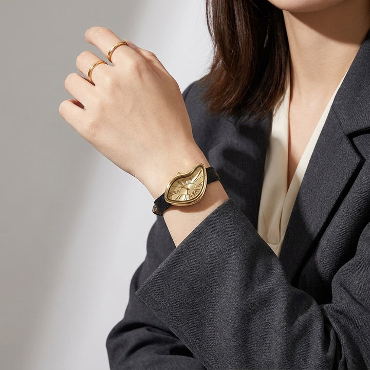 Basel Twisted Watch — Black Gold, worn on the wrist in the studio