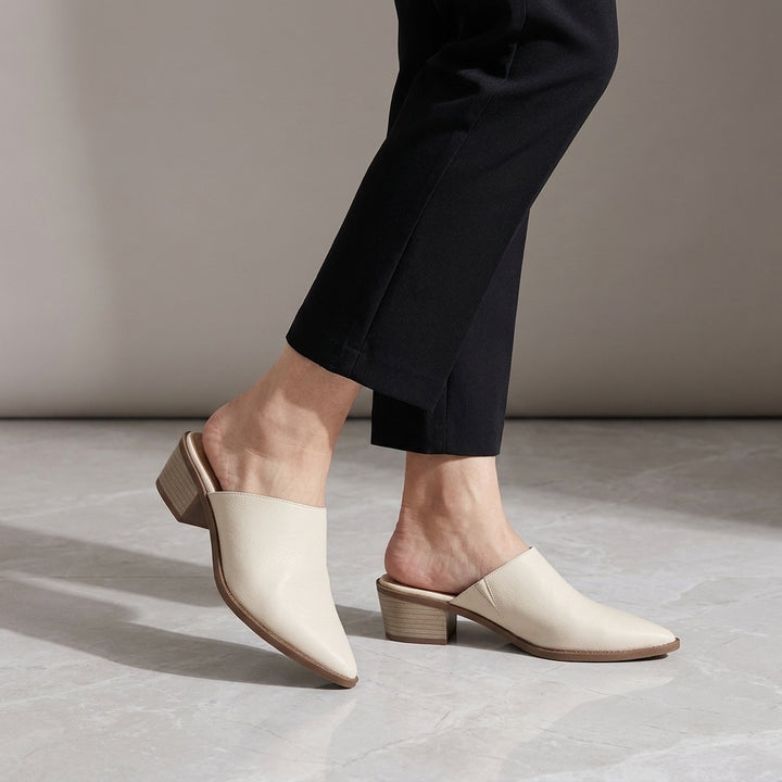 Lucera Leather Mules — Cream, worn, studio view from the knee down