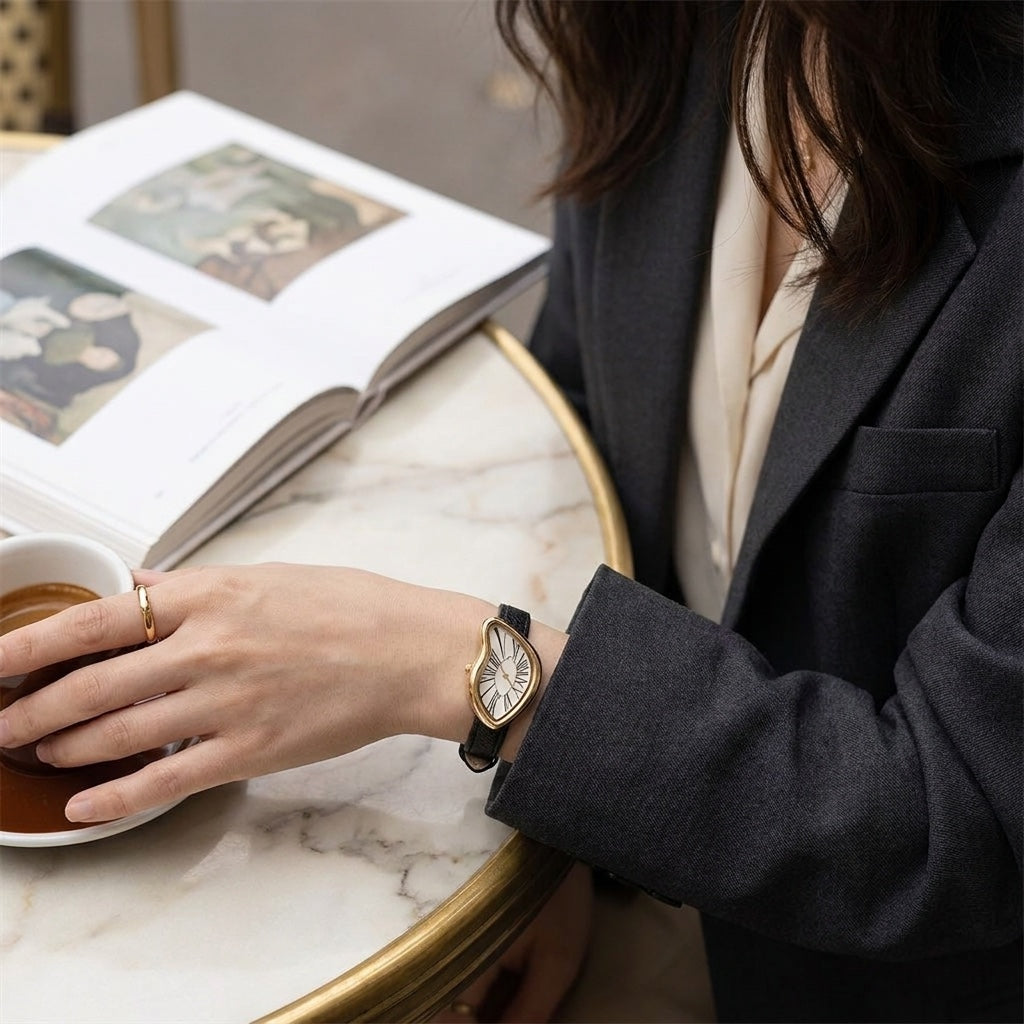 Basel Twisted Watch — Black Ivory, worn at a cafe table