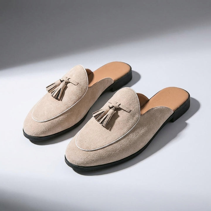 Vasto Suede Mules — Beige, three-quarter front view, both shoes paired, open-back visible