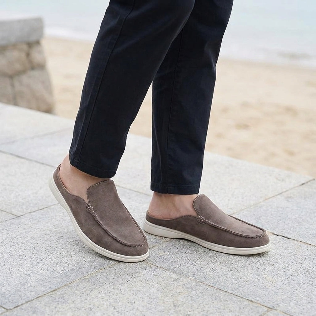 Dartmouth Suede Loafers — Brown, male model knee-down coastal pavement