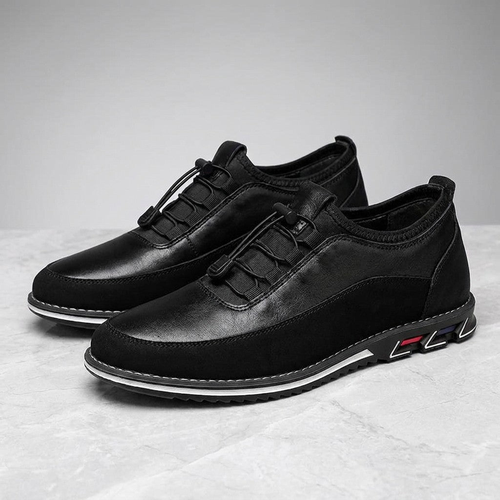 Anagni No-Tie Dress Shoes — Black, pair in three-quarter view on light-grey marble