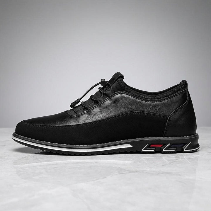 Anagni No-Tie Dress Shoes — Black, single shoe in side profile on light-grey marble