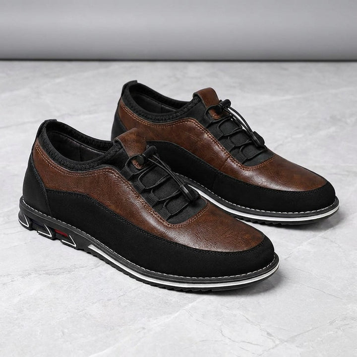 Anagni No-Tie Dress Shoes — Chestnut Brown, pair in three-quarter view on light-grey marble
