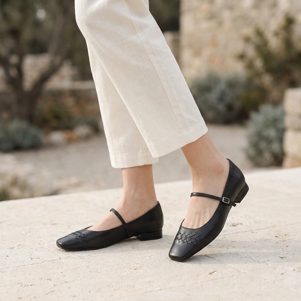 Ravenna Mary Janes — Black, worn outdoors on a stone terrace, from the knee down