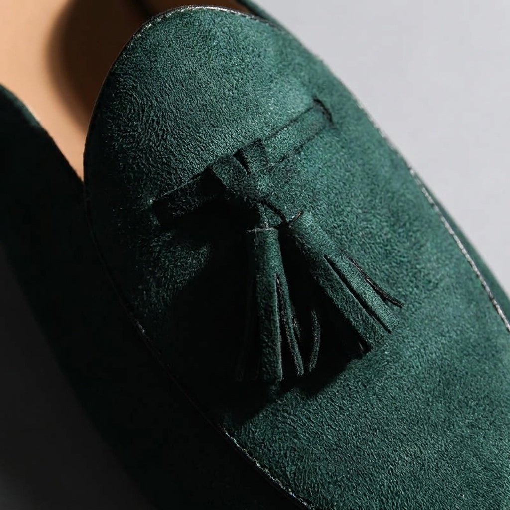 Vasto Suede Mules — Dark Green, close-up tassel and vamp suede texture