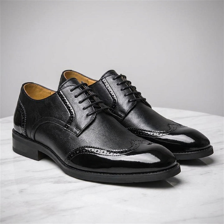 Tortona Leather Wingtip Brogues — Black, three-quarter studio view of the pair