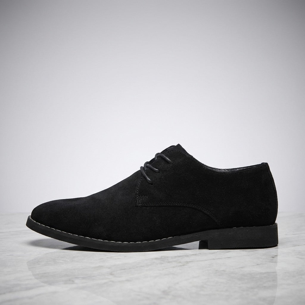 Bari Suede Oxfords — Black, side profile on marble