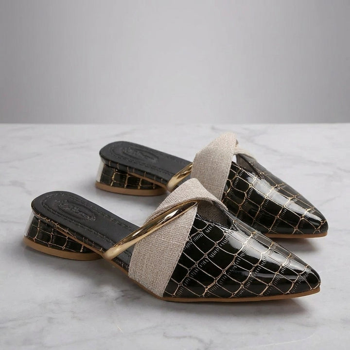 Tivoli Croc-Embossed Mules — Black, pair on marble