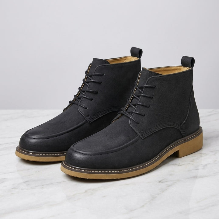 Belluno Leather Boots — Black, pair on marble