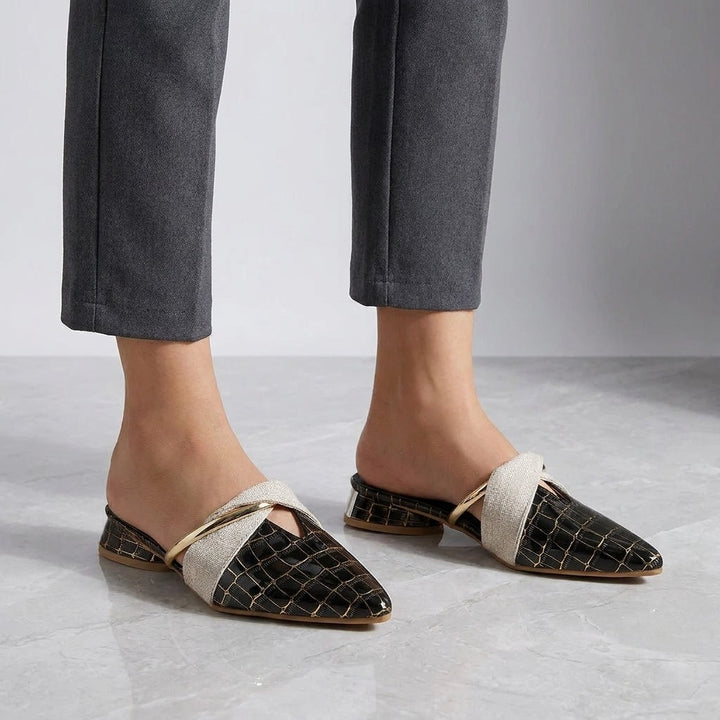 Tivoli Croc-Embossed Mules — Black, on model knee-down studio