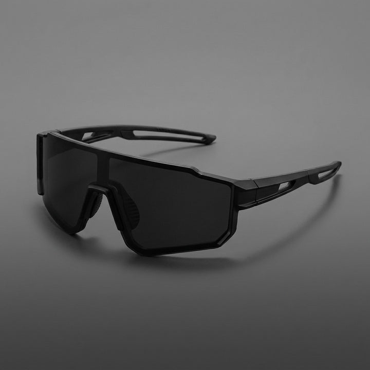 Tellaro Shield Sunglasses — Black / Smoke, three-quarter front view on a grey studio gradient
