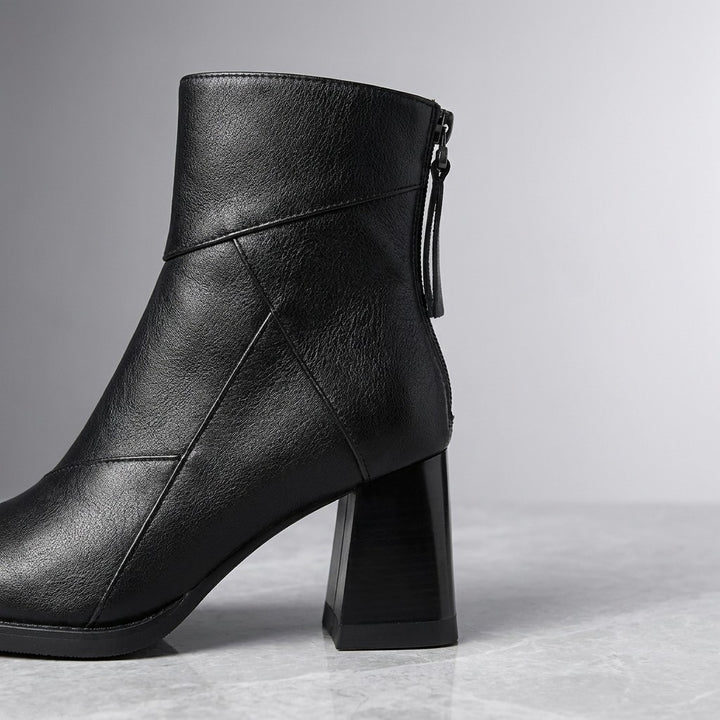 Bormio Paneled Ankle Boots — Black, close-up of the paneled upper, back zip and block heel