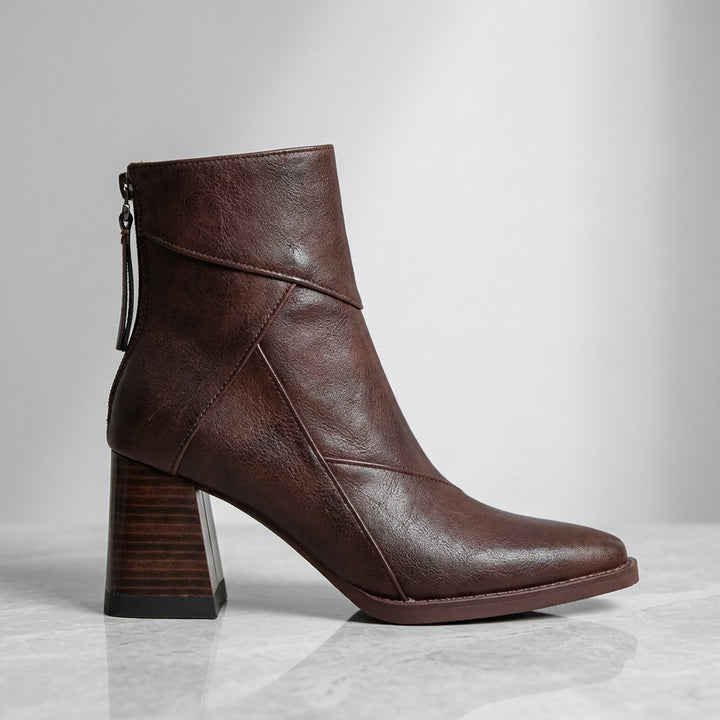 Bormio Paneled Ankle Boots — Brown, single boot in side profile on light grey marble
