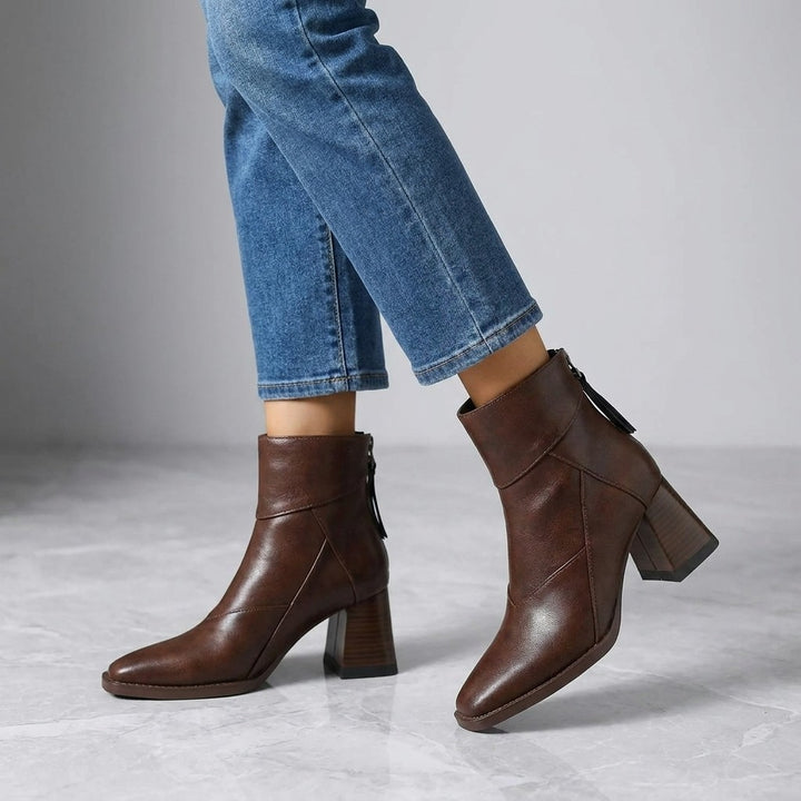 Bormio Paneled Ankle Boots — Brown, worn with cropped blue jeans, knee-down on light grey marble