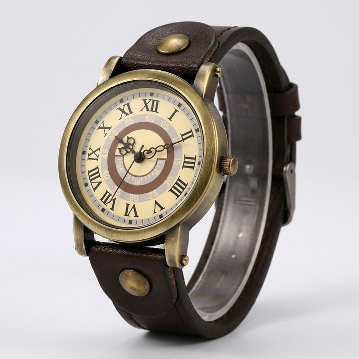Camerino Heritage Watch — Bronze / Dark Brown, cream Roman-numeral dial on a light-grey studio backdrop