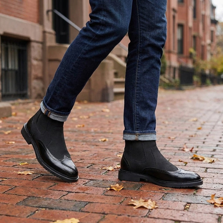 Cittadella Brogue Chelsea Boots — Black, worn with cuffed dark jeans on a brick sidewalk in Boston&