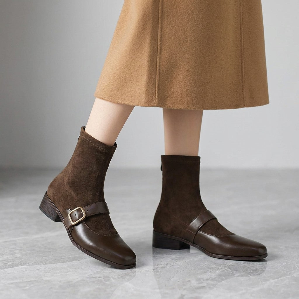 Cosenza Square Toe Ankle Boots — Chocolate Brown, worn by a woman, knee down, on grey marble
