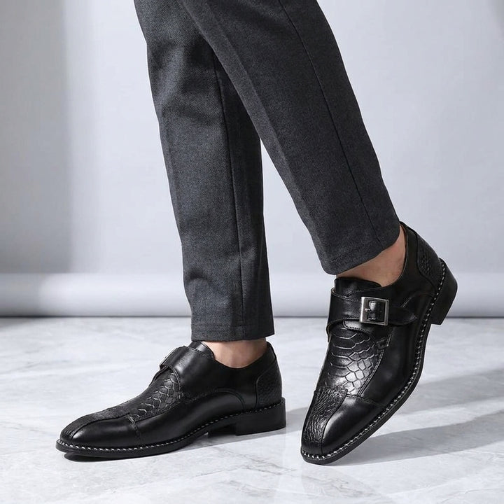 Belgravia Monk Straps — Black, worn knee-down studio view