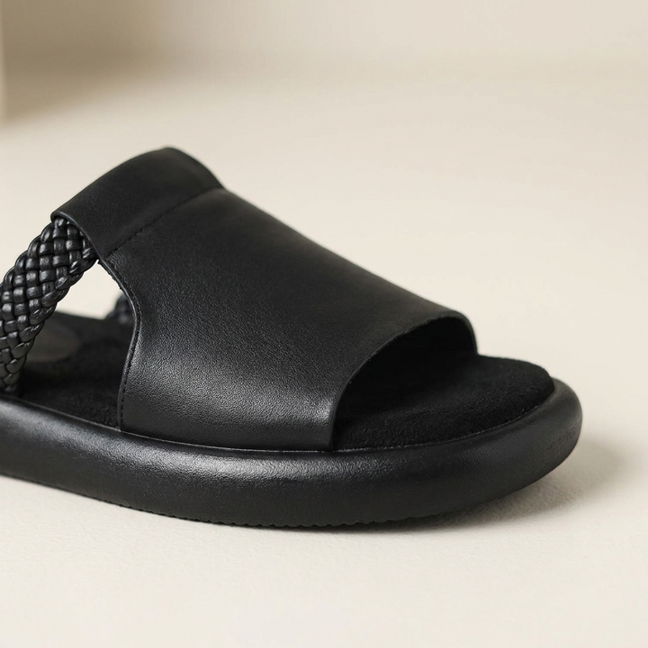 Palermo Leather Slides — Black, close-up upper and sole edge