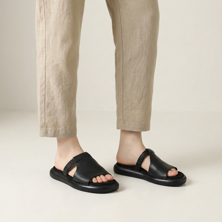 Palermo Leather Slides — Black, knee-down studio model