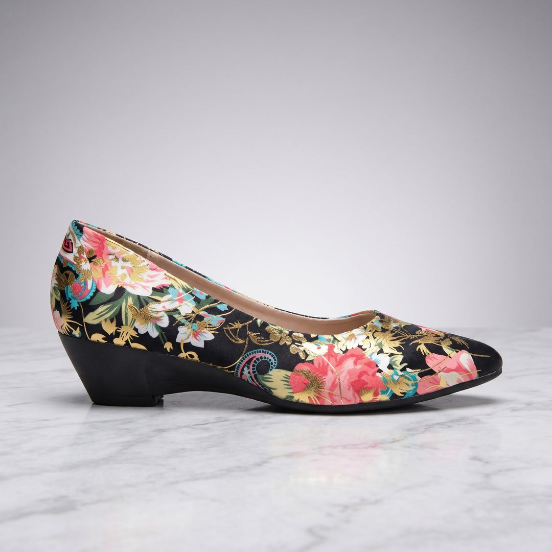 Maiori Pointed-Toe Pumps — Black Floral, side profile of a single shoe showing the low heel