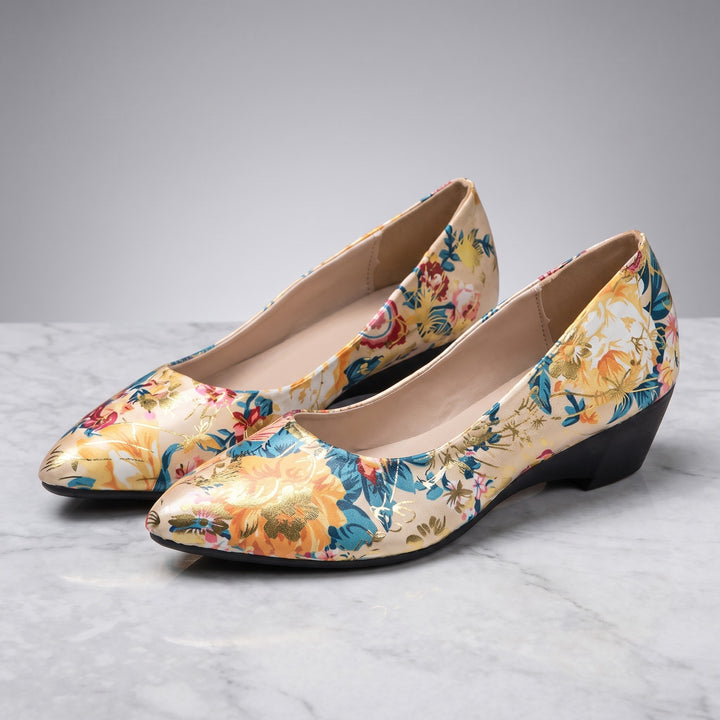 Maiori Pointed-Toe Pumps — Cream Floral, pair in three-quarter view on light-grey marble