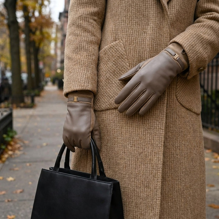 Malcesine Slim Gloves — Taupe, worn with a camel coat on an autumn street