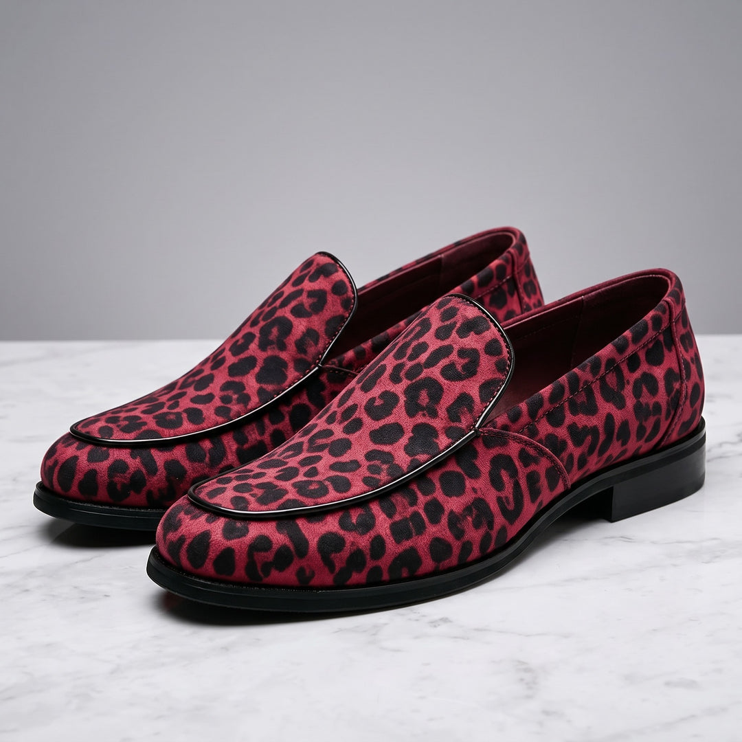 Mantova Suede Loafers — Red Leopard, pair in three-quarter view on light-grey marble