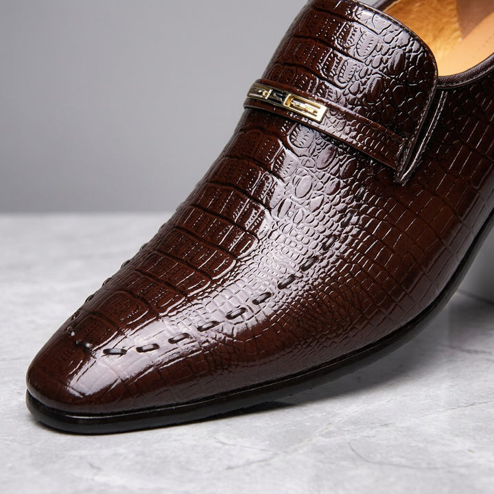 Snakeskin Loafers — Chocolate, close-up of strap ornament and embossed texture