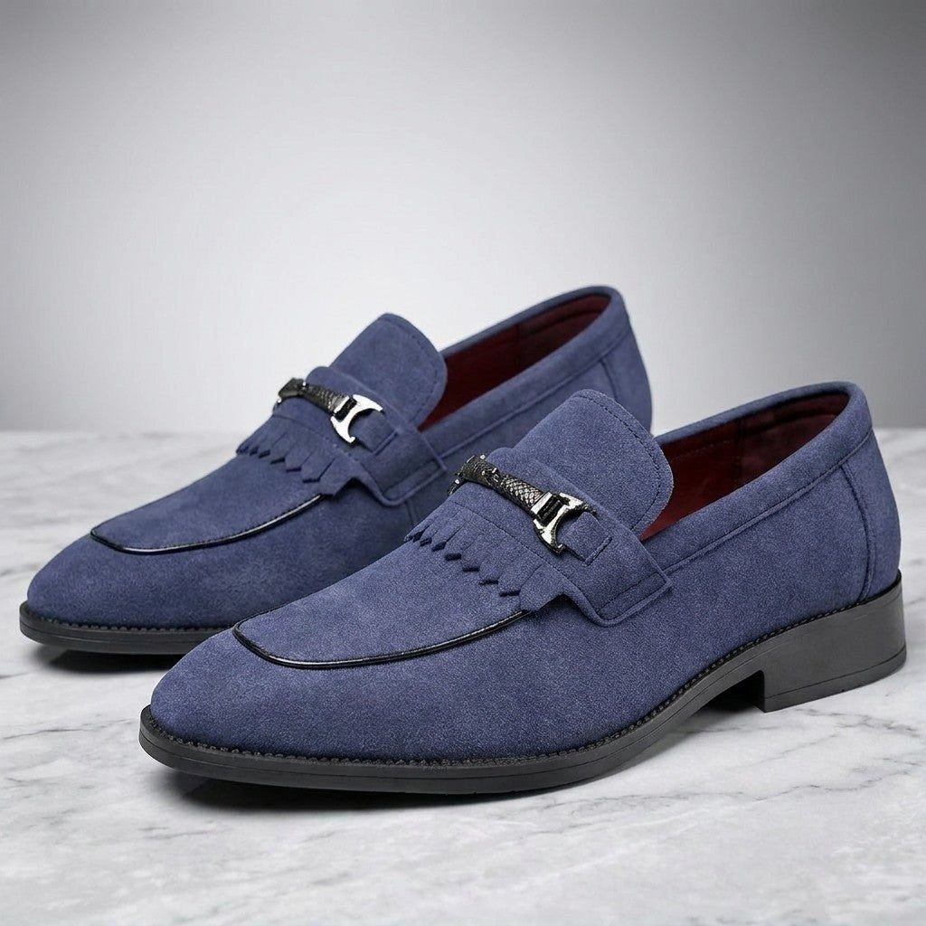 Modica Kiltie Bit Loafers — Blue suede, pair of kiltie bit loafers, three-quarter view on light grey marble