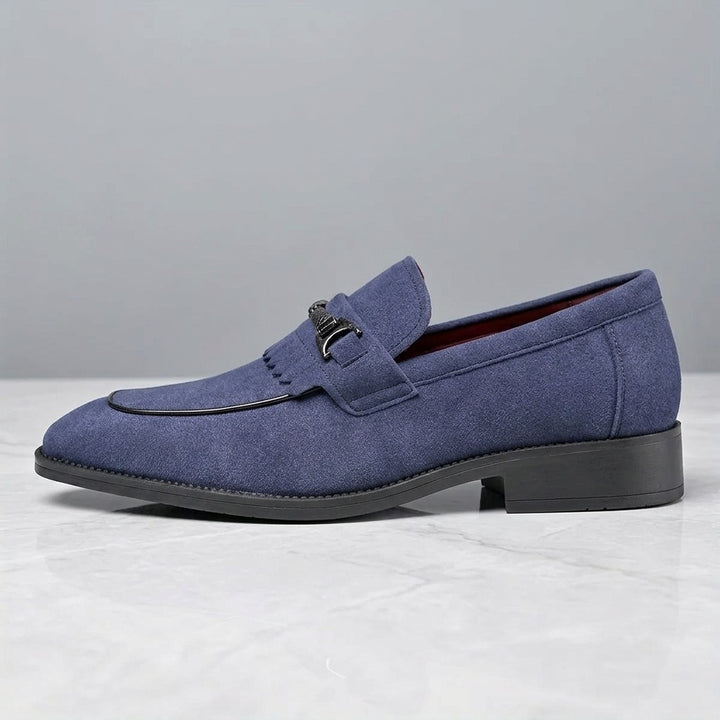 Modica Kiltie Bit Loafers — Blue suede, single loafer in side profile on light grey marble