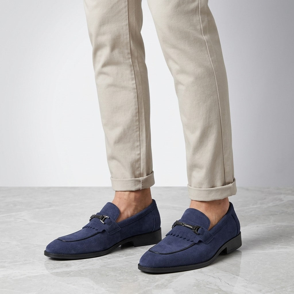 Modica Kiltie Bit Loafers — Blue suede, worn with cuffed stone chinos, knee-down on light grey marble