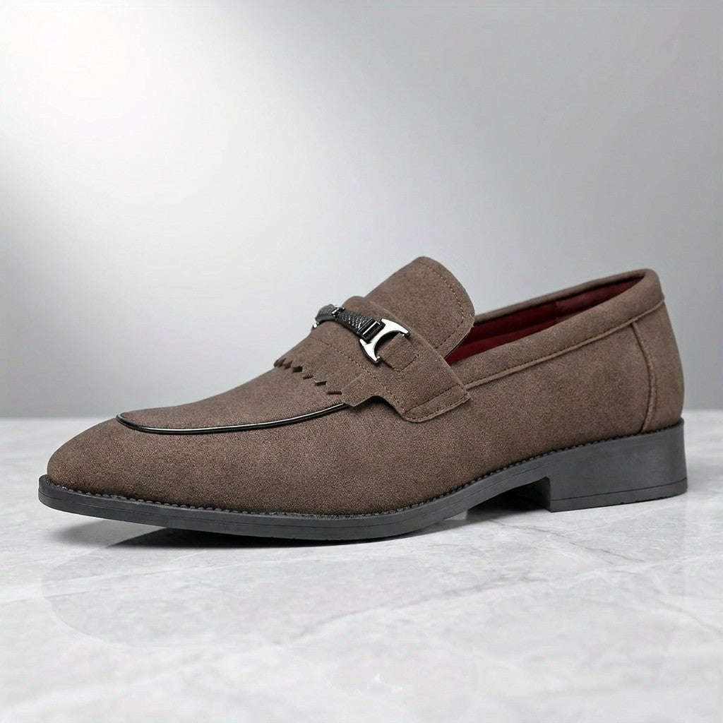 Modica Kiltie Bit Loafers — Brown suede, single loafer in side profile on light grey marble