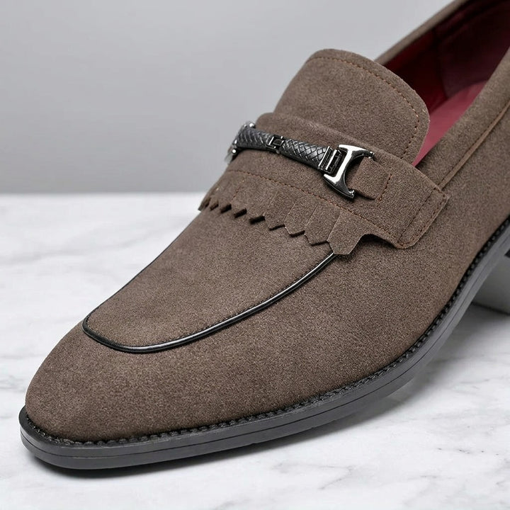Modica Kiltie Bit Loafers — Brown suede, close-up of the silver-tone bit, fringed kiltie and almond toe
