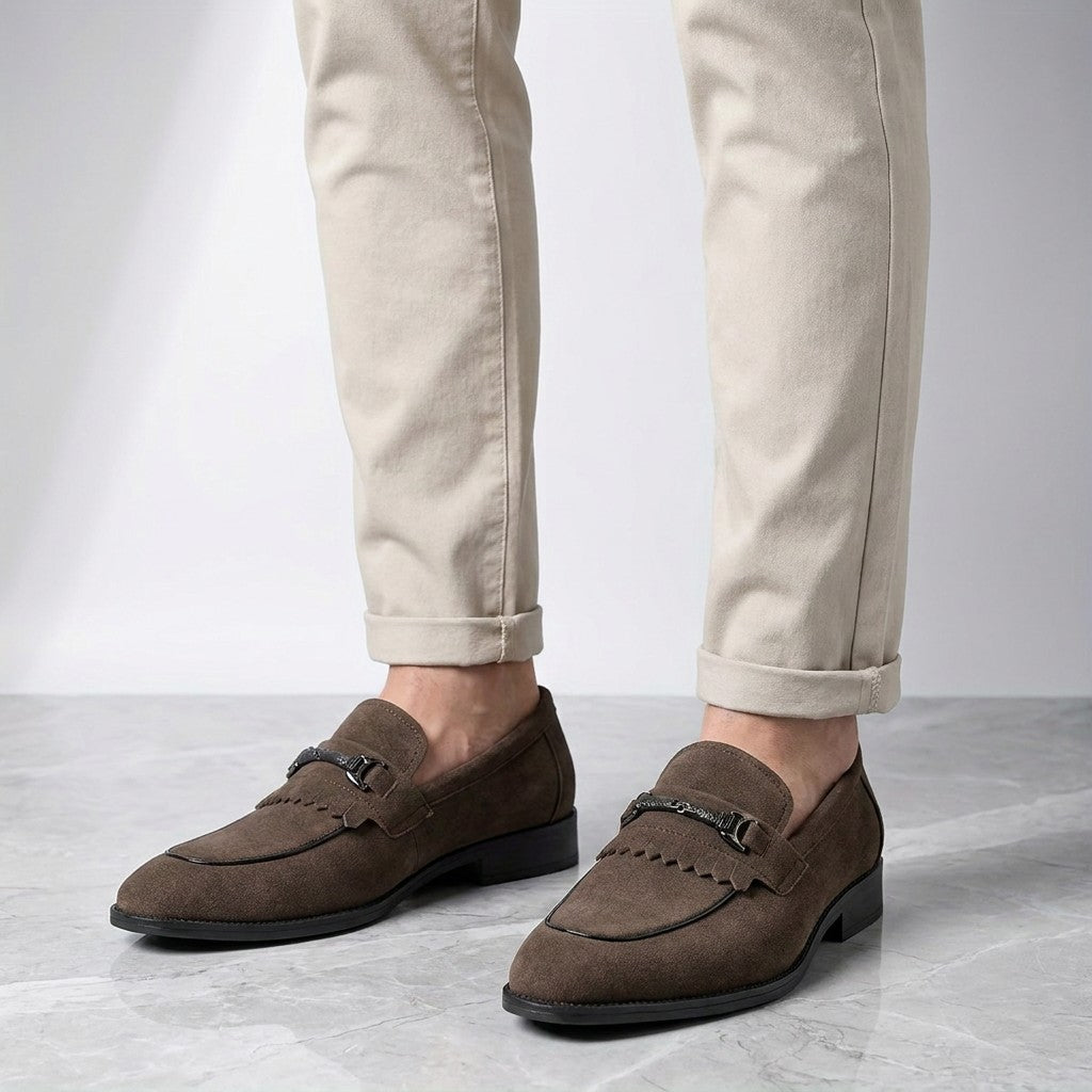 Modica Kiltie Bit Loafers — Brown suede, worn with cuffed stone chinos, knee-down on light grey marble
