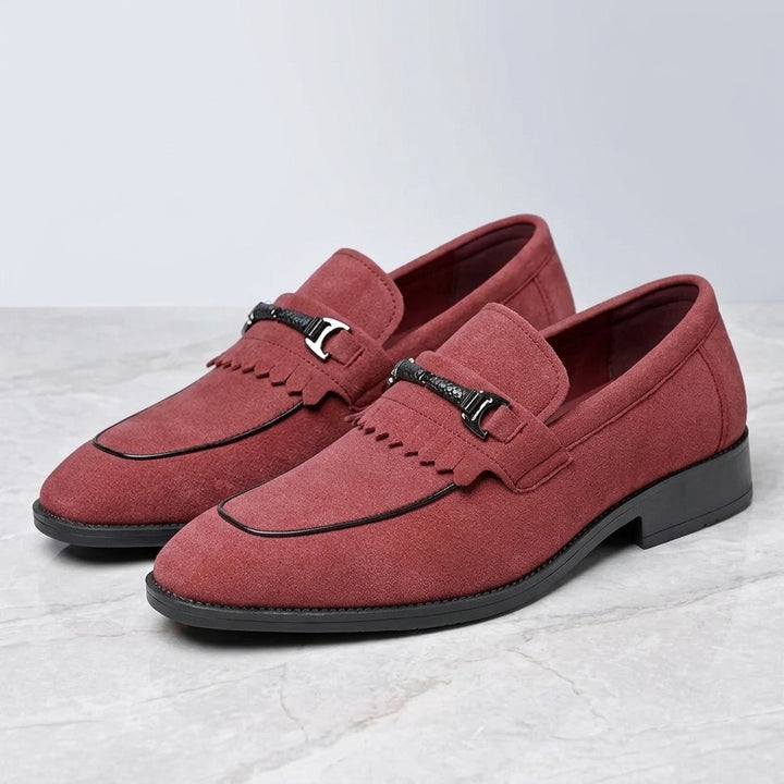 Modica Kiltie Bit Loafers — Red suede, pair of kiltie bit loafers, three-quarter view on light grey marble