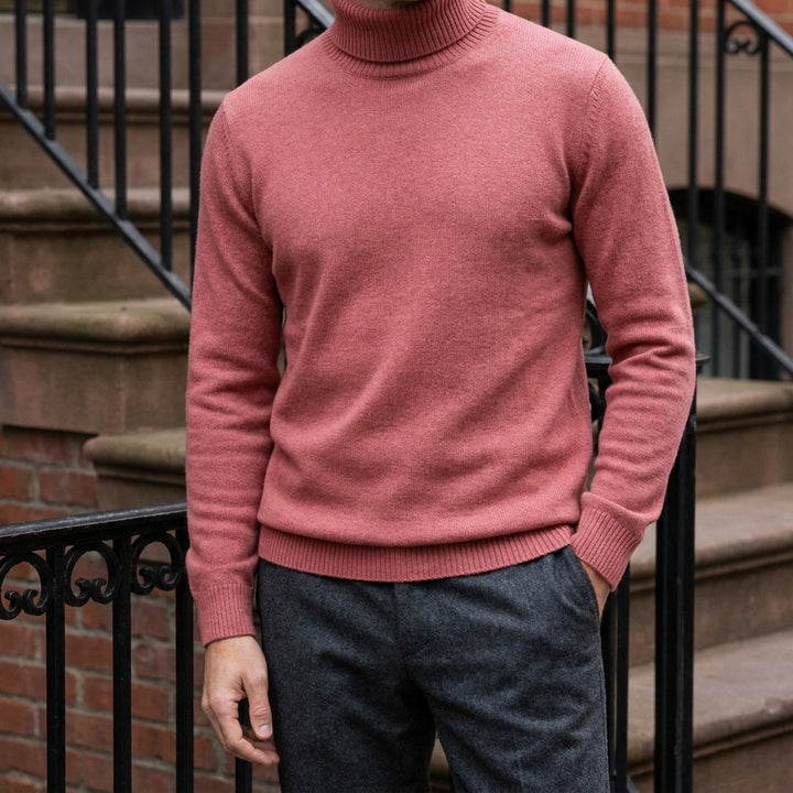 Pistoia Merino Wool Turtleneck — Coral Red, worn on a brownstone stoop