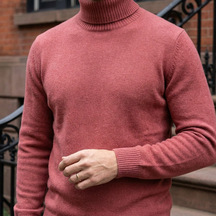 Pistoia Merino Wool Turtleneck — Coral Red, worn close-up of the cuff and knit