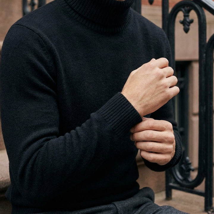Pistoia Merino Wool Turtleneck — Black, worn close-up of the cuff and knit